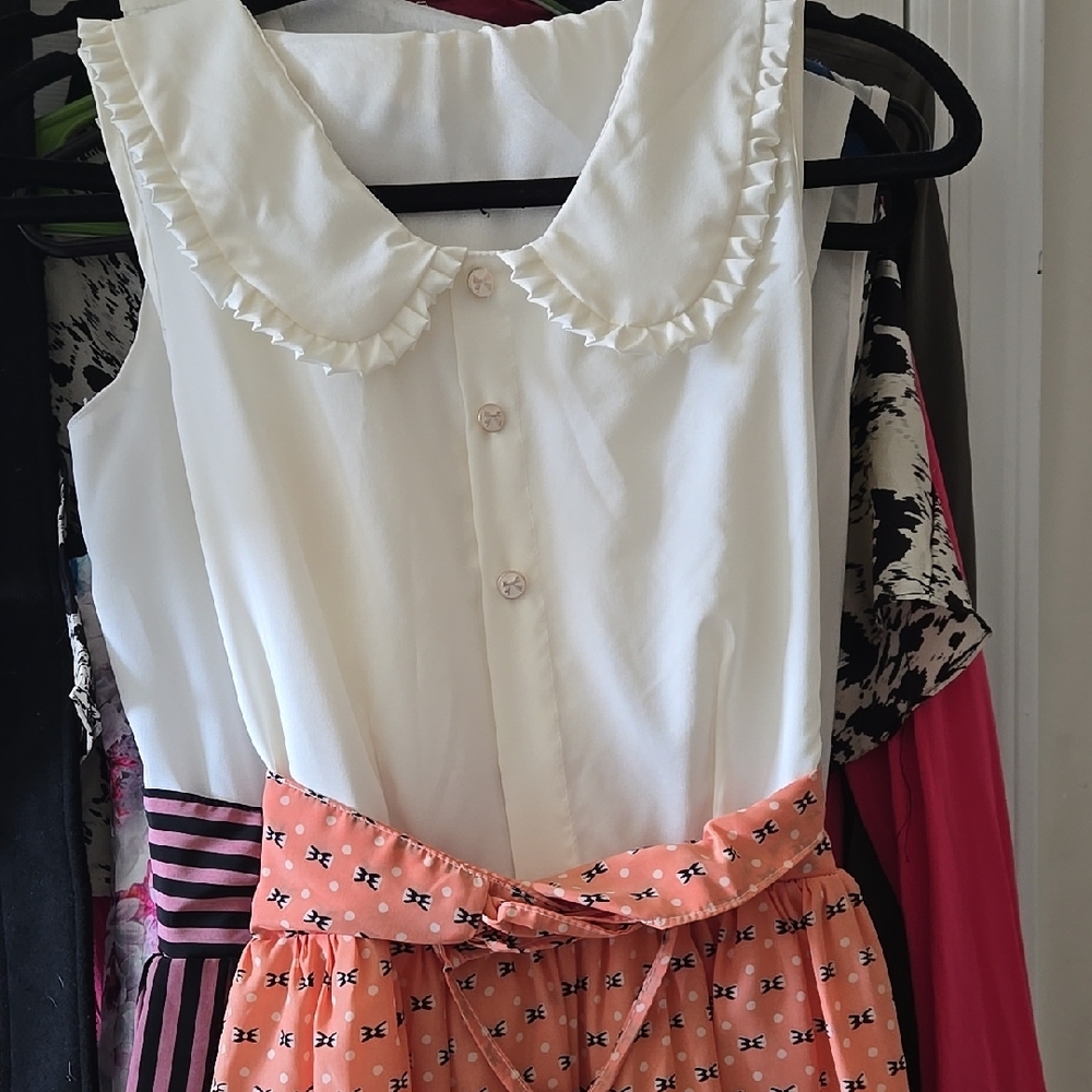 White Ruffled Collar Blouse with Orange Patterned Skirt